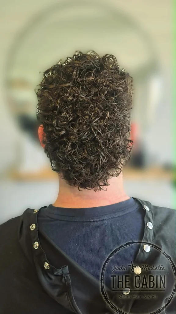 Back view of men's curly perm styling
